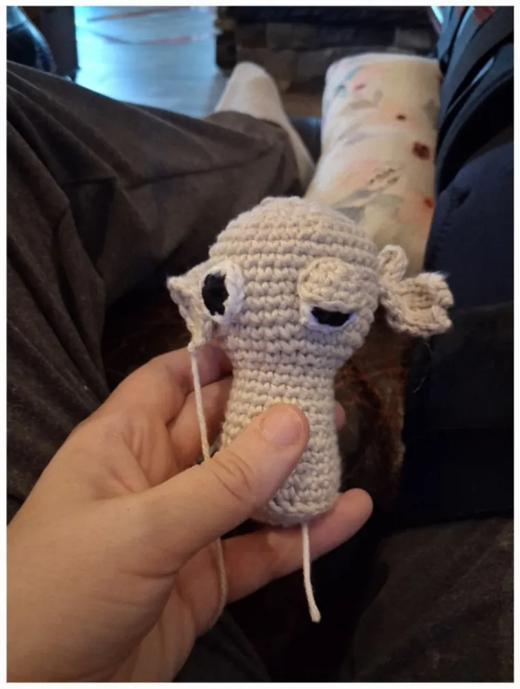 A finished head with eyelids and embroidered features