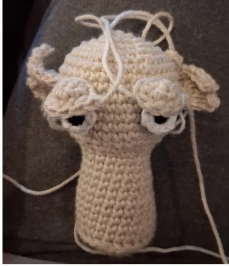 Eyes sewn to the finished head before the eyelids go on